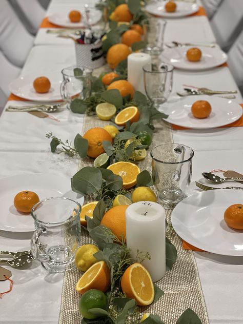 Orange And Lemon Table Decoration, Green Arrangements Leaves, Oranges Party Decor, Eucalyptus And Orange Table Decor, Table Decor With Oranges, Orange Themed Dinner Party, Citrus Wedding Table Decor, Cutie Baby Shower Table Setting, Lemon Table Centerpieces