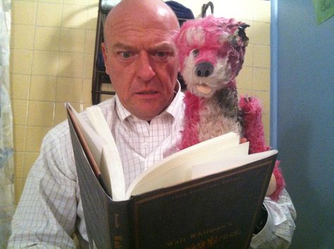 35 Pictures That Will Change The Way You Look At “Breaking Bad”....9. Hank reading a bedtime story to a stuffed animal: Breaking Bad Cast, Hank Schrader, Dean Norris, Vince Gilligan, Vanessa Kirby, Aaron Paul, Bryan Cranston, Walter White, Great Tv Shows