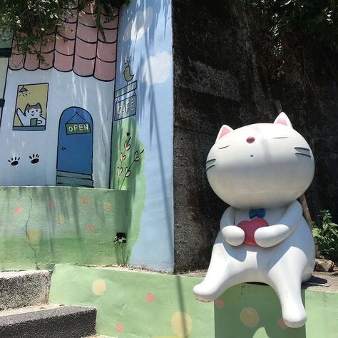 A Cat, Building, Green, Blue