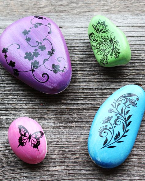 Can you use temporary tattoos on rocks? Yes you can! Come learn this easy DIY technique for getting impressive looking painted rocks. Cleaning Rocks For Painting, Purple Painted Rocks Ideas, How To Prepare Rocks Before Painting, Painted Rocks With Butterflies, Butterflies On Rocks Painted Stones, Rock Games, Rock Painting Supplies, Rock Painting Tutorial, Disney Tattoo