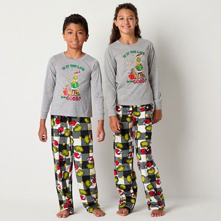 Your big kids will look adorable this festive season thanks to this Grinch themed unisex 2-piece pajama set. Made from soft jersey, it includes a long-sleeve graphic top and coordinating pair of checked printed pajama pants with an elastic-waist. Get matching sets for the whole family. # Pieces In Set: 21st Piece Description: Top1st Piece Fabric: Jersey1st Piece Fiber Content: 100% Polyester1st Piece Care: Machine Wash, Tumble Dry2nd Piece Description: Pants2nd Piece Closure Type: Full Elastic2n Dr Seuss Grinch, Family Pajama Sets, Christmas Pajama Set, Matching Family Pajamas, Graphic Top, Family Pajamas, Kids Pajamas, Christmas Pajamas, Pajama Sets