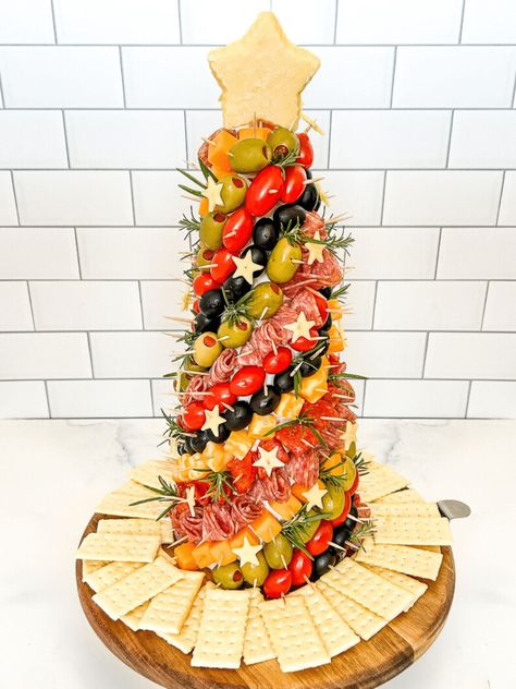 This Charcuterie Tree is a festive appetizer that everyone will love. Make a charcuterie Christmas tree to celebrate the holiday season! Creative Christmas Snacks, Charcuterie Board Ideas Christmas Tree, Antipasto Christmas Tree, Christmas Appies Holiday Appetizers, Charcuterie Christmas Tree Cone, Christmas Tree Charcuterie Tower, Charcuterie Trees, Charcuterie Tree Cone, Charcuterie Board Christmas Tree