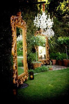 A garden goes glam with oversized gold mirrors. Chandelier Pergola, Chandelier Outdoor, Enchanted Forest Quinceanera Theme, Enchanted Forest Quinceanera, Enchanted Wedding Theme, Enchanted Forest Prom, Enchanted Forest Decorations, Chandelier Designs, Pergola Outdoor