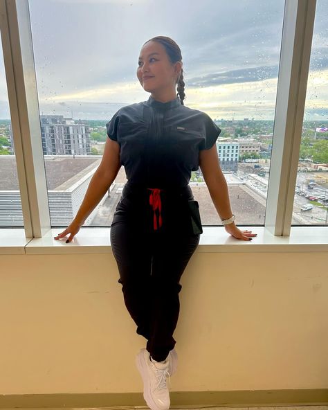 "Channeling my inner fig nurse in this sleek grey jumpsuit. #RockingIt #FigNurseStyle"#figs#NurseLife#scrubstyle#NurseFashion#ComfortandStyle##figsjumpsuit Jumpsuit Black Women, Nurse Outfits, Burgundy Scrubs, Christian Flag, Nurse Aesthetic, Grey Jumpsuit, Scrubs Outfit, Nursing Fashion, Medical Aesthetic