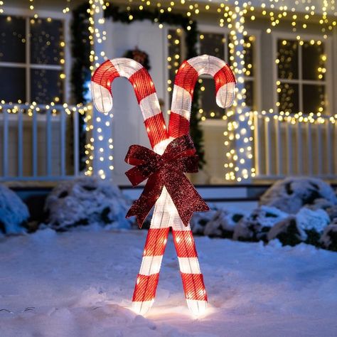 Joiedomi 3 ft. tinsel candy canes with 50 LED warm white yard light is used as a yard decoration to create wonderful, lifelong memories for the youngsters in your life. It's easy to set up and can secure it in place with included stakes. Ideal for winter decoration, Christmas night event, and Winter Wonderland themed party. SYNCFUN 36-in Candy Cane Door Decoration with White LED Lights | 30206 Small Outdoor Christmas Decor, Christmas Candy Outdoor Decorations, Winter Wonderland Themed Party, Winter Wonderland Party Theme, Cane Door, Christmas Tree Dog, Christmas Reindeer Decorations, Tree Theme, Christmas Yard Decorations