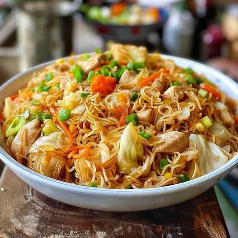 🍜 Best Filipino Pancit: Savor the taste of the Philippines! #PancitPerfection Best Filipino Pancit Ingredients: Rice noodles (1 lb (450 g)) Soy sauce (3 tbsp (45 ml)) Chicken breast, sliced (1 lb (450 g)) Cabbage, shredded (1 cup (150 g)) Carrots, julienned (1 cup (130 g)) Onion, sliced (1) Garlic, minced (2 cloves) Chicken broth (2 cups (480 ml)) Instructions: Soak noodles in warm water. Sauté chicken, garlic, onion. Add veggies. Stir in noodles, broth, soy sauce. 🍲 Dive into this tradit... Sauté Chicken, Filipino Pancit, Pancit Recipe, Chicken Garlic, Instagram Recipes, Twisted Recipes, Sauteed Chicken, Comfort Dishes, Trending Recipes