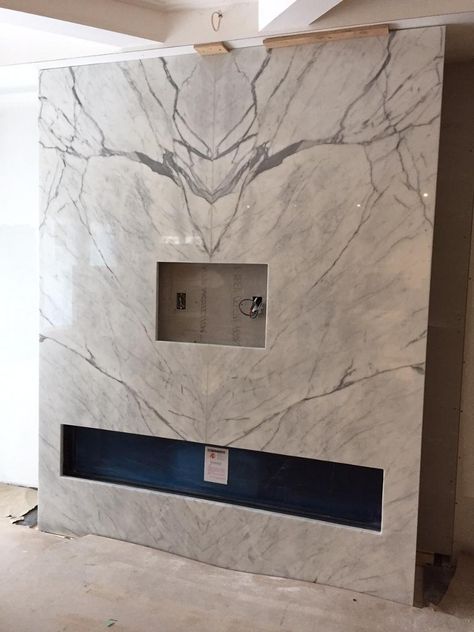 Fireplace supplied by Marble Trend using Statuario bookmatched. Neolith Estatuario, Grey Wallpaper Living Room, Kitchen Feature Wall, Granite Tiles, Marble Trend, Statuario Marble, Classical Interior, Fireplace Tv Wall, Family Room Walls