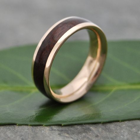 Comfort Fit Yellow Gold Lados Walnut Wood Ring with 100% Recycled 14k Yellow Gold, interior and exterior.  Comfort Fit design with contoured inner band, this rounded Lados design features recycled 14k yellow gold edges and Kentucky walnut wood. Rounded outer profile (also available with a flat profile). This listing is for all yellow gold exterior and interior, but may be made in other metals upon request.  This listing is made to order in the size you request in 7mm width. Other widths availabl Wooden Wedding Bands, Wooden Wedding Ring, Wood Wedding Ring, Wood Wedding Band, Yellow Gold Wedding Ring, Organic Jewelry, Yellow Gold Wedding Band, Wood Wedding, Gold Wedding Ring