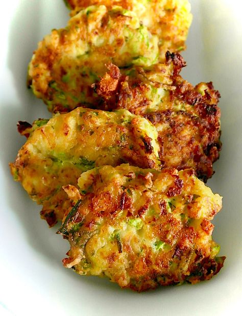 5 Delicious Greek Zucchini Recipes | Olive Tomato Greek Zucchini, Olive Tomato, Zucchini Patties, Greek Appetizers, Zucchini Chips Baked, Zucchini Feta, Leafy Salad, Popular Appetizers, Roast Zucchini