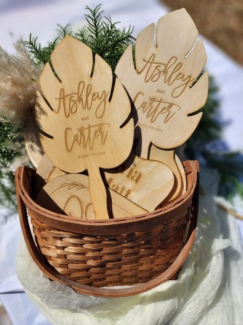 "♥ ♥ These are wooden fans, laser engraved with your custom information. ♥ They are the perfect favor for an outdoor wedding or event, and make a great souvenir. ♥ They measure approx 9.5 in (length) x 6 in (width) ♥ Personalized and Engraved with name & date or short phrase. Text is only engraved on one side. The other side is blank. ♥ These are fully functional and sturdy fan but yet light to hold, perfect for an outdoor wedding or event and will be appreciated by guests. ♥ Made with smooth 1/ Wooden Fan Wedding Favors, Laser Engraved Gifts Koyal Wholesale Weddings, Bamboo Wedding Favors, Laser Engraved Gifts Wedding Favors, Wooden Fans Wedding Favors, Laser Engraved Wedding Decor, Wooden Wedding Favors, Laser Engraving Wedding Ideas, Laser Cut Wedding Favors