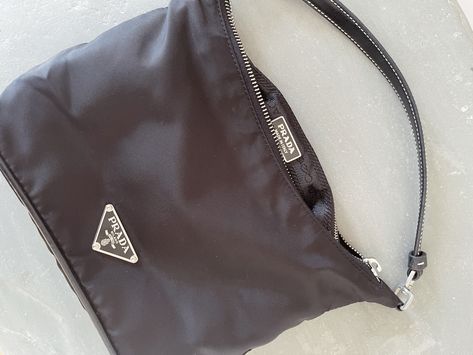 How to spot af fake Prada bag | The Archive Interior Logo, Prada Bags, Triangle Logo, Vintage Bar, Leather Pulls, Nappa Leather, Prada Bag, Purse Wallet, Prada