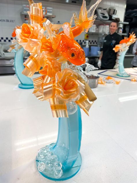 My experience participating in the Sugar Art Essential Techniques class at Le Cordon Bleu London, including the creation of an intricate goldfish themed sugarwork sculpture made using a mix of blown, pulled, and poured sugar techniques. Pulled Sugar Art, Blown Sugar, Sugar Sculpture, Confectionary Art, Le Cordon Bleu, Art Essentials, Cordon Bleu, Sugar Art, Goldfish