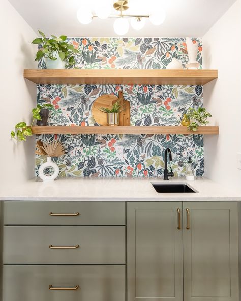 Bold & Beautiful ✨🍸 This cozy wet bar is the perfect pop of personality with muted green cabinets, honey bronze hardware, and a statement-making wallpaper. The floating wood shelves and quartz countertop add a touch of warmth and elegance to the mix. Cheers to a space as functional as it is fun! 🥂 #bold #interiordesign #designer #stl #maryvilleil #roamdesigncompany #modern #organic #spoonflower #wetbar #fyp #trending #wallpaper Paper Shelves, Floating Wood Shelves, Trending Wallpaper, Muted Green, Quartz Countertop, Green Cabinets, Modern Organic, Bronze Hardware, Bar Areas