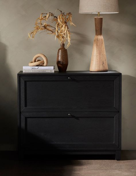 A transitional nightstand clad in oak and finished in black for impact. The wide silhouette accommodates two spacious drawers, offering ample bedside storage. Style as a pair to flank your bed with a stately bearing. Black Nightstand Bedroom, Bedside Table Styling, Transitional Nightstand, Nightstand Styling, Nightstand Design, Black Nightstand, Black Bedside Table, Reclaimed Doors, Bedside Storage