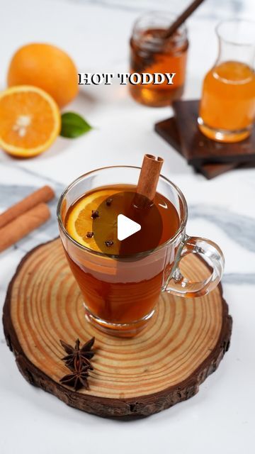 NIKITA SHAH | FOOD & TRAVEL on Instagram: "Hot Toddy

There’s nothing like cozying up with a classic hot toddy when it’s pouring outside. This soothing, comfy drink is my go-to so try it today & enjoy the rainy day vibes! 

Ingredients:
¾ cup Water
1 tsp Black Tea
1 Star Anise
1 Cinnamon Stick
2-3 Cloves
2 tsp Honey
¼ cup Orange Juice
1 Orange Round

Method:
- In a saucepan bring water to a boil, add in the black tea, star anise, cinnamon stick and let it simmer 
- In a glass pour honey & orange juice 
- Strain and pour the black tea into the glass mug 
- Garnish with an orange round pierced with cloves (as shown in the video) and a cinnamon stick and sip away!

#hottoddy #blacktea #orangejuice #hotdrink #drinkoftheday #trending #tealovers #nonalcoholic" Rainy Day Vibes, Hot Toddy Recipe, Orange Juice Drinks, Hot Toddies Recipe, Hot Toddy, Star Anise, Glass Mug, Food Travel, Black Tea