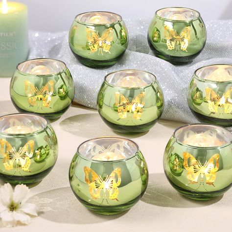 PRICES MAY VARY. ❤️Green Votive Candle Holders-Perfect for Vintage Home Decor and Green Wedding Theme Parties: This glass votive candle holder with unique butterfly pattern is of high quality. When lit, it projects beautiful butterfly light, creating a dreamy and charming atmosphere for you. ❤️Perfect Green Candleholders Decoration：Use this green candle holder at your wedding or dining table, with beautiful butterflies dancing, creating a romantic and unique atmosphere for you. It is especially Fairy Tea Party Table Decor, Princess Tiana Table Decor, Wedding Decorations Olive Green, Fairy Garden Table Centerpiece, Cottage Core Table Decor, Victorian Tea Party Decorations, Quince Butterfly Theme Centerpieces, Princess And The Frog Sweet 16 Decor, Princess And The Frog Wedding Theme Ceremony Decor