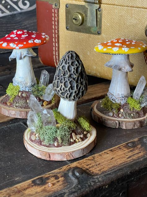 "This listing is for one handmade free standing mushroom sculpture of your choosing.  These sculptures would make for whimsical desk decor, or add the perfect touch of fantasy to your book shelf.  Each mushroom is hand sculpted out of polymer clay and painted with acrylic paints.  This original one of a kind sculpture is then attached to a wooden slice and adorned with real Quartz crystals, rocks, and preserved moss.  Sculptures stand roughly 5\"-6\" tall and the wooden base has a circumference Mushroom Sculpture, Polymer Clay Mushroom, Clay Mushroom, Mushroom Crafts, Fairy Garden Crafts, Sculpture Stand, Mushroom Decor, Mushroom Art, Diy Clay Crafts