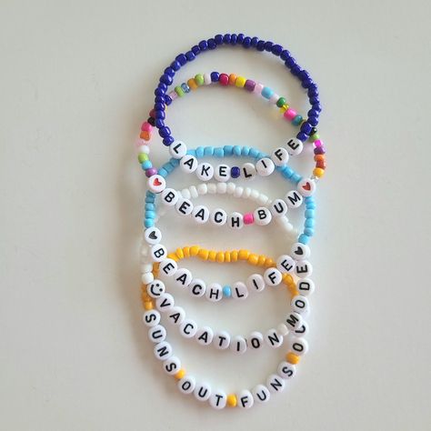 Custom Seed Bead Name Bracelet Set. Each Set Comes With 5 Bracelets For $27. Strung On Strong Stretch Cord. Brand New Condition. Ships Next Business Day Offers Are Welcome Personalize Your Stack With Your Favorite Summer Phrase, Your Name, Special Date, Or Occasion. Message Me With Your Desired Size, Color, And What You Want Your 5 Bracelets To Say. Choose From All The Colors Pictured Above. Sizes: Xs 6", S 6.5", M 7", L 7.5", Xl 8" Example 1) Name Melissa, Color White, Size 7 2) Names Ava Nora Word Bracelets Beads, Best Bracelets Women, Beaded Bracelet Words, Beaded Bracelets Words, Friendship Bracelet Patterns With Beads, Bracelet Sayings, Buissnes Ideas, Seed Beaded Bracelets, Name Bead Bracelet