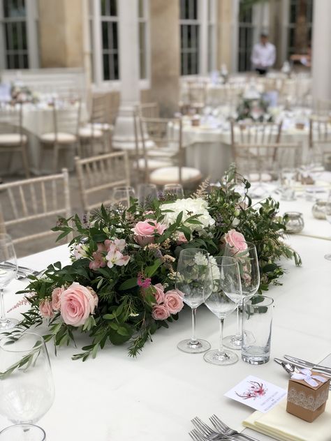 Soft and pretty top table arrangement for an oval table at syon Park Oval Top Table Wedding Flowers, Bridal Table Flowers Arrangements Long, Dinner Table Flowers Centerpiece Ideas, Low Centerpieces Wedding Long Table, Wedding Flowers For Long Tables, Flower Centrepiece For Round Table, Low Floral Arrangements For Table, Long Floral Centerpiece Wedding, Long Low Flower Arrangement