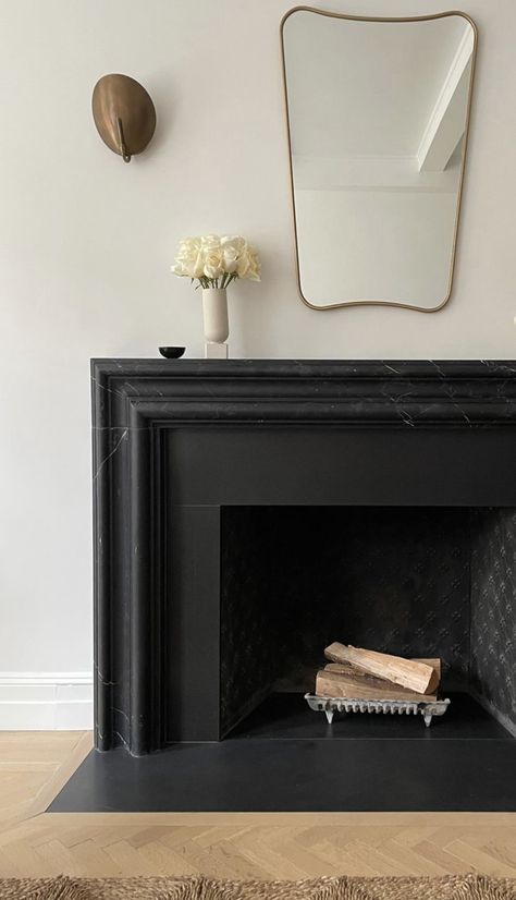 Fireplace Slate Surround, Black Fluted Fireplace, Black Limestone Fireplace, Modern Tudor Fireplace, Black Plaster Fireplace Surround, Next To Fireplace Decor, Granite Hearth Fireplace, Black Granite Fireplace Surround, Black Quartz Fireplace Surround