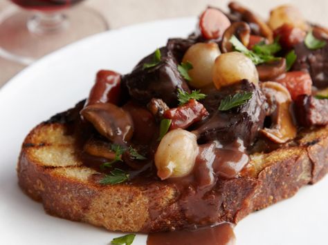 Ina Garten's Beef Bourguignon - In this foolproof take on the classic, often complex French stew, beef is simmered in red wine in the oven — not on the stove — at a constant temperature for perfect results every time. http://www.foodnetwork.com/recipes/ina-garten/beef-bourguignon-recipe.html Beef Bourguignon Recipe, Ina Garten Recipes, Munnar, Beef Dishes, Food Network, Main Dish, Soups And Stews, Taste Buds, Food Styling