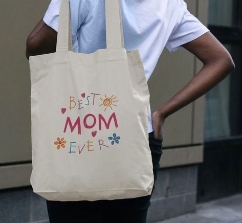 This Best Mom Ever Tote Bag Mum Eco-Friendly 100% Organic Cotton is made to stand out. Take a step towards reducing single-use plastics with this reusable printed bag. We've produced this product using water-based inks with low waste printing technology. Ready to ship in our marine design paper packaging. Mothers Day Tote Bag, Marine Design, Album Journal, Mom Tote Bag, Low Waste, Design Paper, Best Mom Ever, Mom Day, Paper Packaging