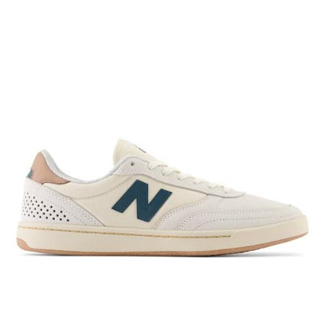 The NB Numeric 440 is a low-profile skate shoe with lineage tracing back to New Balance's heritage of classic  70's style running shoes. With its C-CAP heel wedge helping to absorb impact and keep it lightweight  the 440 has the board feel of a vulcanized shoe with the impact protection of a cupsole. The upper is constructed with dual layers of suede in the high-wear zones along with breathable mesh side panels and reflective heel perforations  making the 440 not only comfortable  but extremely White And Gold Shoes, Green Hoodie Men, Military Hoodie, White Hoodie Men, Teal Shoes, Skateboard Logo, New Balance Numeric, Skate Shop, Skate Shoe