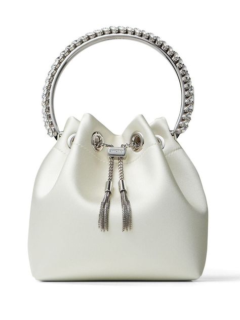 Ivory-white stain/leather Bon Bon bucket bag from JIMMY CHOO featuring single rounded top handle, drawstring fastening, internal zip pocket and bucket body. Jimmy Choo Bon Bon Bag, Luxurious Outfits, Glitter Pumps, Jimmy Choo Bag, Crystal Clutch, Bag Silver, Satin Bags, Fancy Bags, Handbag Heaven