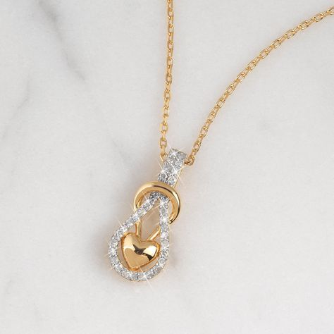 The infinity knot with a glistening puffed heart, reflects endless love in a modern way. Genuine white diamonds embellish the infinity knot and add beauty to the stunning pendant in 18kt gold-plated sterling silver. A sumptuous presentation pouch — perfect for gift-giving and safekeeping — is included at no additional charge. Real Diamond Necklace, Diamond Pendent, Infinity Knot, Infinity Heart, Gold Ring Designs, Puffed Heart, Danbury Mint, Heart Pendant Diamond, Diamond Chain