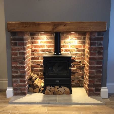 Brick Fireplace Log Burner, Fireplace Surround Ideas, Exposed Brick Fireplaces, Wood Burner Fireplace, Wood Burning Stoves Living Room, Log Burner Fireplace, Log Burner Living Room, Brick Slips, Cottage Fireplace