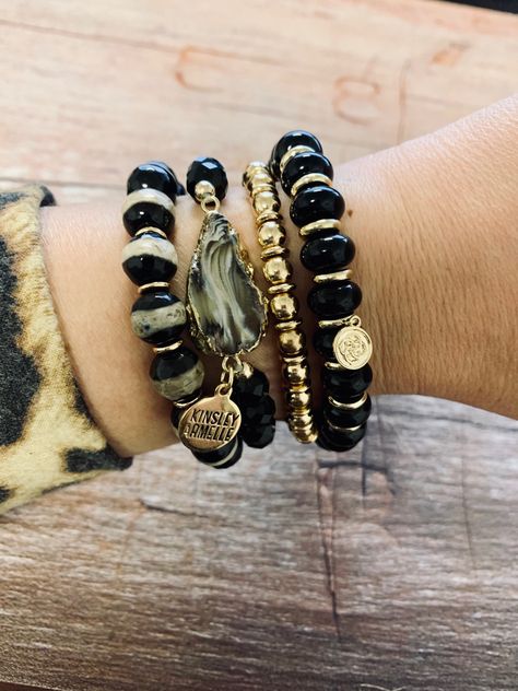 Bracelet Stack: Kinsley Armelle Mixed Collections (L to R)-Farrah Collection Zoe Bracelet in black, Agate Collection Tailor Bracelet in black, Goddess Collection Belle Bracelet in gold, and Kendra Scott Rebecca Stretch Bracelet in Black. Black Stackable Beaded Bracelets As Gift, Elegant Black Stackable Beaded Bracelets, Black Stackable Bracelet, Adjustable Black Stackable Stretch Bracelet, Belle Bracelet, Black Bohemian Stretch Bracelet Stackable, Bracelet Stacks, Black Goddess, Black Bracelet