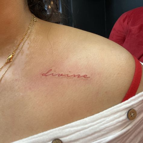 Red Simplistic Tattoo, Feminine Script Tattoos, Divine Rib Tattoo, Divine Collar Bone Tattoo, Divine Tattoos For Women, Divine Script Tattoo, Divine Fine Line Tattoo, Divine In Cursive, Red Feminine Tattoo