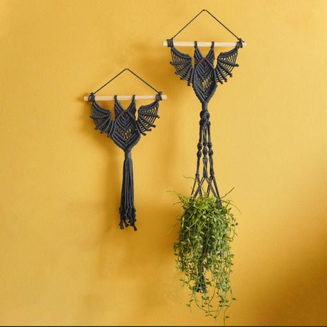 PRICES MAY VARY. UNIQUE DESIGN: Elevate your room decor with the Macrame Gothic Bat Hanging Decor, which adds a touch of witchy and boho style to your space. The intricate macrame work features a detailed bat design that is sure to catch the eye of anyone who walks into the room. This piece is perfect for those who love unique and original decor. DURABLE MATERIAL: Crafted from high-quality handcrafted cotton yarn, this hanging plant holder is durable and long-lasting. It's designed to resist fad Autumn Macrame, Goth Plants, Black Boho Decor, Potted Plant Gift, Macrame Baskets, House Plant Decor, Alaska Living, Frickin Bats, Intricate Macrame