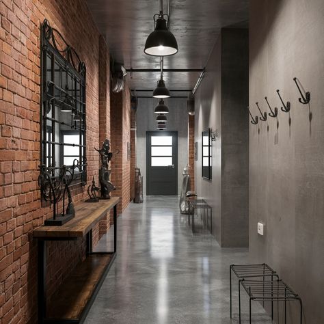 Industrial chic interiors with a cozy twist! What do you think of exposed brick walls? 🏙️💖 #interiordesign #industrialdesign #design #industrialstyle Exposed Brick Salon Spaces, Warehouse Venue Industrial Chic, Cement And Brick Wall, Exposed Pipes Interior Design, Brick Industrial Interior, Industrial Library Design, Concrete Wall Interior Design, Industrial Foyer, Concrete Walls Interior