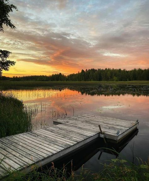 A pier by the lake at sunset in Joutsa in the Jyväskylä Region Sunset On A Lake, Summer Cottage Aesthetic, Finnish Cottage, Lake Aesthetics, Finnish Summer, Scandinavian Landscape, Summer Camp Aesthetic, Tropical Paradise Beach, Finland Summer