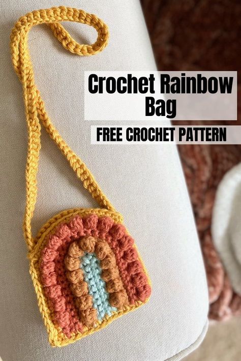 Learn how to make this easy Crochet Rainbow Purse by following this free crochet pattern modification to the Bitty Boho Bag. Crochet Cute Bags Free Patterns, Bitty Boho Bag Pattern Free, Crochet On The Go Bag, Granny Square Pouch Crochet Pattern, Crochet Rainbow Bag Free Pattern, Crochet Rainbow Purse, Crochet Purse For Kids, Easy Crochet Patterns Free Beginners Simple, Teen Crochet Projects