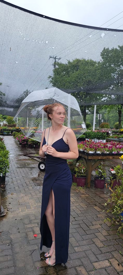 Girl standing outside of a greenhouse in the rain for prom pictures posing with an umbrella Raining Prom Pictures, Prom Pictures In The Rain, Rainy Birthday Party Ideas, Rainy Day Prom Pictures, Rainy Graduation Pictures, Rainy Prom Pictures, Pictures In The Rain, Prom Picture Ideas, Rainy Day Pictures