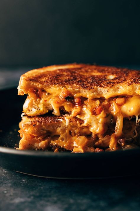 Kimchi Grilled Cheese! Melty cheese with a caramelized kimchi and bacon filling sit between two thick slices of sourdough bread. YUM! #grilledcheese #kimchi #sandwich Kimchi Sandwich, Kimchi Grilled Cheese, Tofu Burger, Classic Grilled Cheese, Fermented Cabbage, Kimchi Recipe, Sandwich Fillings, Grilled Cheese Recipes, Melty Cheese