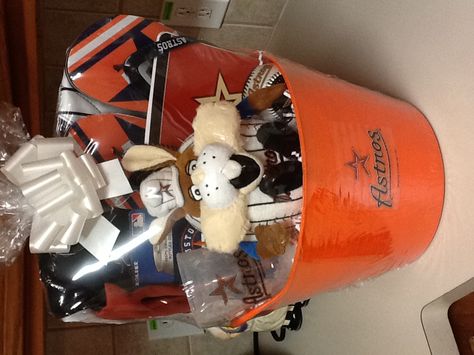 Astro's basket for $65, includes men's flip flops,cup,ball,gloves,snack bag,notepad,can holder,astro bunny. Astros Gifts, Flip Flop Basket, Ball Gloves, Baseball Ideas, Astros Baseball, Gift Baskets For Men, Raffle Baskets, Baseball Party, Can Holder