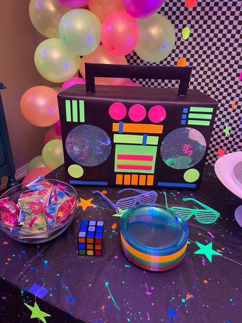 Easy DIY w/ rectangle box, neon card stock and black butcher paper. Diy 80s Centerpieces, Diy Boom Box Cardboard, Diy 80s Decorations, Diy Neon Party Decorations, 80s Party Decorations Diy, Start The Party Vbs 2024, Diy 80s Party Decorations, Neon 80s Party, 90s Party Ideas