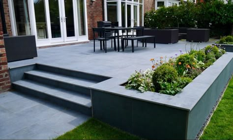 Raised Garden Decking Ideas, Terrace Stone Floor, Raised Patio Design, Garden Patio With Steps, Raised Patio With Steps Down To Garden, Patio With Steps Down To Garden, Patio Steps Down To Garden, Grey Porcelain Patio, Raised Patio Ideas