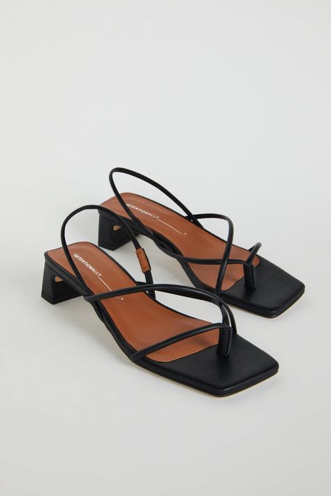 MEET FREYA Strappy with the perfect low heel, this dress sandal is perfect for elevating your warm weather shoe game. SHOP SIMILAR STYLES Leather upper Memory foam footbed Halter strap with elastic for comfort Heel 1.5 inches True to size Whole sizes only Made in Spain FREE DOMESTIC SHIPPING AND RETURNS ON ALL ORDERS OVER $200 Any item sold at a discount of 30% or greater is not refundable/returnable. Strappy Black Sandals Heels, Black Strappy Low Heels, Black Sandals Heels Low, 1 Inch Heels Sandals, Low Heel Sandals Outfit, Low Black Heels, Low Heels Outfit, Sandals For Dress, Short Heel Sandals