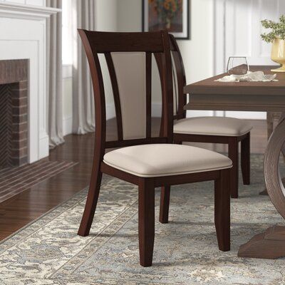 This 2-piece set of slat back side chairs combine the best of modern versatility and classic charm for a versatile design we love. They're made with a solid and engineered wood frame in a rich dark cherry finish. We love the traditional armless Parsons silhouette, which is easy to pull underneath tables of all styles. These chairs are padded with foam throughout the seat and boast leatherette upholstery for the look of leather without the upkeep. They come together with only partial assembly req Glass Dining Room Table, Tufted Side Chair, Classic Dining Room, Chair Design Wooden, Parsons Dining Chairs, Modern Bungalow House, Modern Dining Room Tables, Dining Chair Design, Upholstered Side Chair