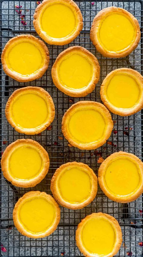 These Hong Kong Style Egg Tarts are an absolute treat! They're so buttery, flaky, and the smooth and silky custard filling is undeniably luscious. This is perfection in a dessert! #eggtarts #recipe #dessert Egg Tart Recipe Hong Kong, Chinese Egg Tart Recipe, Egg Custard Tart Recipe, Chinese Egg Tart, Hong Kong Egg Tart, Pancake Mix Uses, Egg Custard Recipes, Egg Tart Recipe, Egg Custard Pie