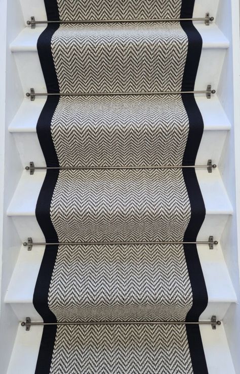 High Quality  Stunning  Herringbone Stair Runner With 100% Cotton Black Border We craft our stair runners using fine quality herringbone design flat weave Carpet, Made in England. Transform your stair with elegance using our exquisite carpet stair runner.  This runner is not only durable but also soft to the touch, making it the perfect addition to your home.  The  Herringbone with black 100% cotton border will complement any interior and create a warm and inviting atmosphere. All of our edging Black Herringbone Stair Runner, Black Stair With Runner, Stair Runner Grey, Staircase Runner Carpet, Hall Carpet Ideas, Stairs Runner Carpet, Black Carpet Stairs, Herringbone Carpet Stairs, Stair Runner With Rods