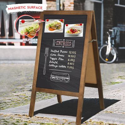 GREAT FOR DISPLAYING: Perfect for displaying menus or promotional messages outside your store, pub, or cafe. Also great for wedding receptions, birthday parties, baby announcements, family gatherings! So many uses! | Latitude Run® Sturdy Sandwich Board Menu Display Magnetic Wall Mounted Chalkboard Wood in Brown, Size 33.3 H x 17.9 W x 1.8 D in | Wayfair Pizza Twists, Chalkboard Stand, Chalkboard Easel, Menu Display, Menu Stand, Sandwich Board, Restaurant Business, Framed Chalkboard, Menu Board