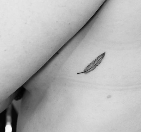 Tiny feather tattoo Tiny Feather Tattoo, Feather Rib Tattoos, Trap Tattoos For Women, Feather Arrow Tattoo, Small Feather Tattoo, Tiny Bird Tattoos, Petit Tattoo, Ear Tattoo Ideas, Finger Tattoo For Women