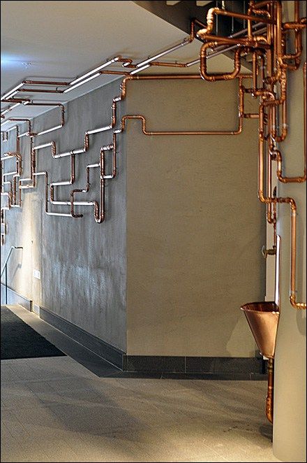 As customer amenity this Copper Water Fountain would catch the eye, even without the runaway copper piping. I’m sure the… Industrial Hallway, Luminaria Diy, Industri Modern, Modern Industrial Interior, Copper Pipes, Copper Bar, Industrial Bedroom, Industrial Design Furniture, Vintage Industrial Style