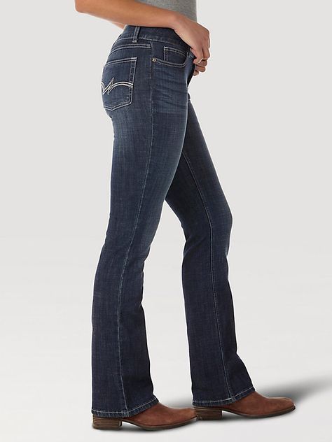 CLASSIC AND SIMPLE BOOTCUT STYLE Look no further than our essential bootcut for classic women's everyday jeans. Sitting comfortably below the waist, our women's mid-rise bootcut jeans offer a bit of stretch for casual denim that works for every occasion. The classic bootcut leg opening makes this versatile style perfect for pairing with boots or heels for an elevated look that enhances your figure. Made with the quality you've come to expect, Wrangler® jeans for women are a closet staple you can Bootcut Jeans With Boots Outfits, Bootcut Jeans Outfit With Boots, Simple Country Outfits, Best Bootcut Jeans, Wrangler Jeans Women's, Bootcut Jeans Outfit, Wrangler Women, Midrise Jeans, Ariat Jeans