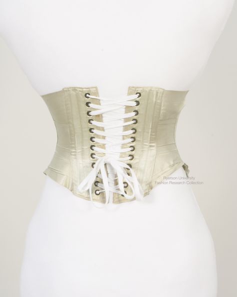 Light green ribbon corset, with back lacing panel, front fastening hook and eye busk, busk lined with white plush at front. C. 1990s. FRC 2014.07.231 Ribbon Corset, Hook And Eye, Green Ribbon, Light Green, Ribbon, Mini Dress, Lace, Green, White